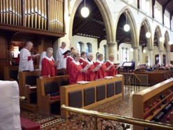 The choir sings during the service marking the reopening of St Nicholas Parish Church after 33 weeks.